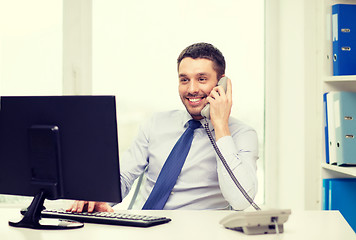 Image showing smiling businessman or student with computer