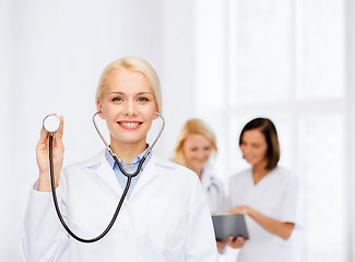 Image showing smiling female doctor with stethoscope