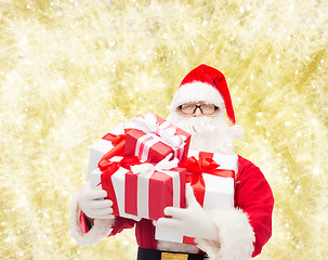 Image showing man in costume of santa claus with gift boxes