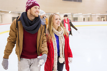 Image showing happy friends on skating rink