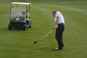 Image showing Male golfer playing golf