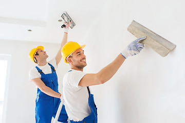 Image showing group of builders with tools indoors