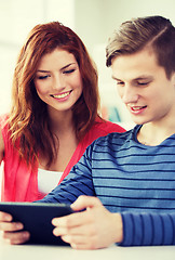 Image showing smiling students with tablet pc at school