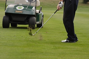 Image showing Male golfer playing golf