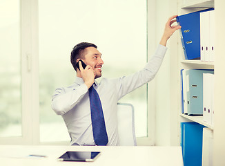 Image showing businessman with smartphone and tablet pc