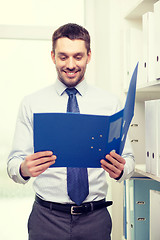 Image showing businessman with folder at office