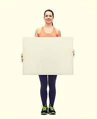 Image showing teenage girl in sportswear with white board