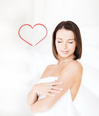 Image showing beautiful woman standing in towel