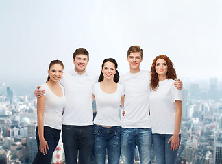 Image showing group of smiling teenagers in white blank t-shirts