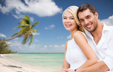 Image showing couple having fun and hugging on beach