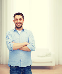 Image showing smiling man with crossed arms
