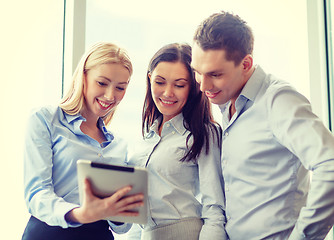 Image showing business team working with tablet pc in office