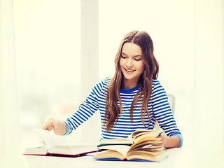 Image showing happy smiling student girl with books