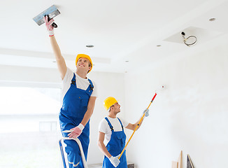 Image showing group of builders with tools indoors