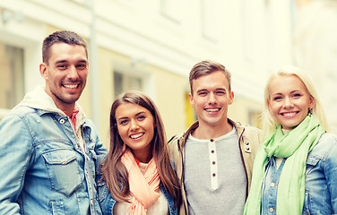 Image showing group of smiling friends in city