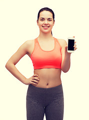 Image showing sporty woman with smartphone