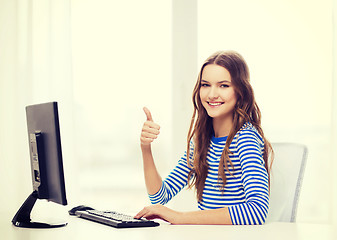 Image showing dreaming teenage girl with computer at home