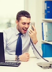 Image showing screaming businessman or student with computer