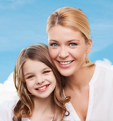 Image showing smiling mother and little girl