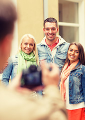 Image showing group of smiling friends taking photo outdoors