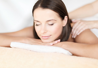 Image showing beautiful woman in spa salon getting massage