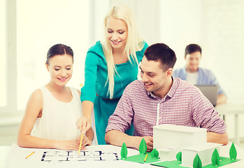 Image showing smiling architects working in office