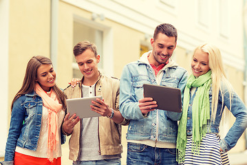 Image showing group of smiling friends with tablet pc computers