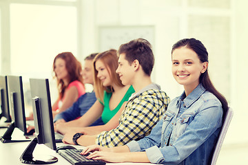 Image showing female student with classmates in computer class