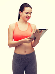 Image showing sporty woman with tablet pc computer