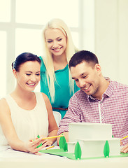 Image showing smiling architects working in office