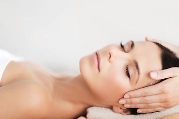 Image showing beautiful woman in spa salon having facial