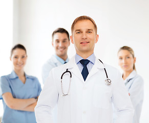 Image showing smiling male doctor with stethoscope