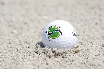 Image showing Golf ball in sand trap