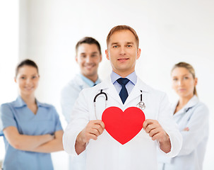 Image showing smiling male doctor with red heart and stethoscope