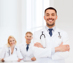 Image showing smiling male doctor with stethoscope