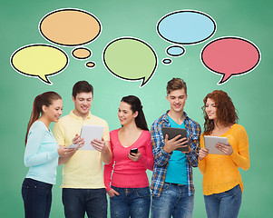 Image showing group of teenagers with smartphones and tablet pc