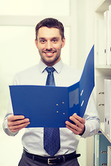 Image showing businessman with folder at office