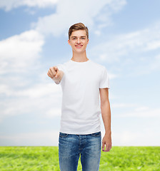 Image showing smiling young man in blank white t-shirt