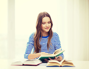 Image showing happy smiling student girl with books