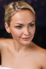 Image showing close up of young woman sitting in bath towel