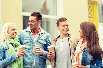 Image showing group of smiling friends with take away coffee