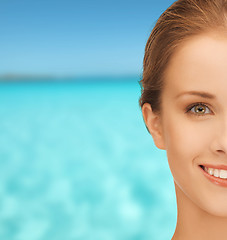 Image showing beautiful young woman over blue sky and sea