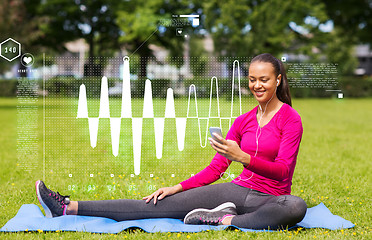 Image showing smiling african american woman with smartphone