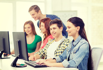 Image showing female student with classmates in computer class