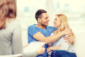 Image showing young couple hugging at psychologist office