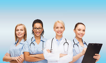 Image showing smiling female doctor and nurses with stethoscope