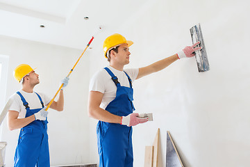 Image showing group of builders with tools indoors