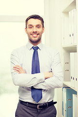 Image showing handsome businessman with crossed arms at office