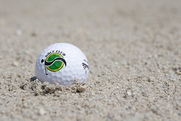 Image showing Golf ball in sand trap