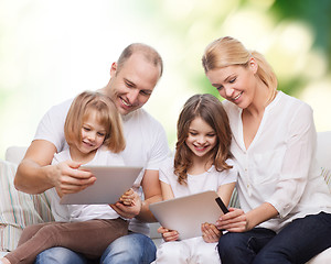 Image showing happy family with tablet pc computers